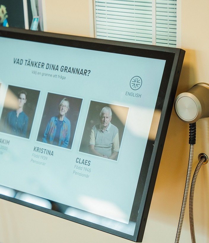 En bildsk&auml;rm med fotografier p&aring; personer och rubriken "Vad t&auml;nker dina grannar?".